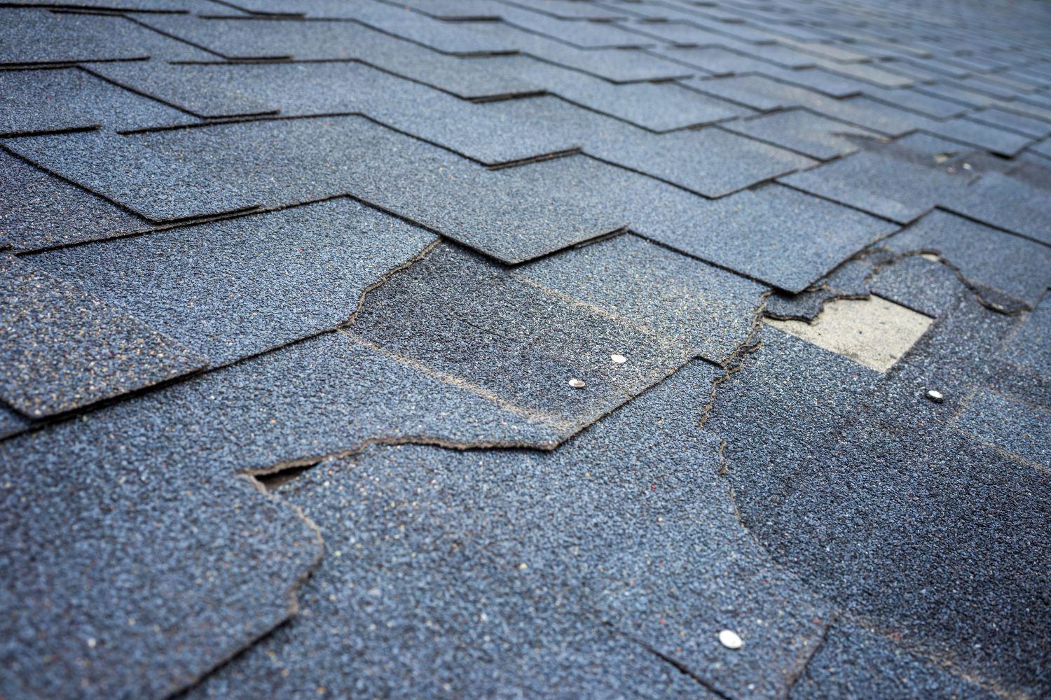 Cracked and split shingles on a roof